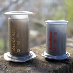 AeroPress coffee maker next to AeroPress Go