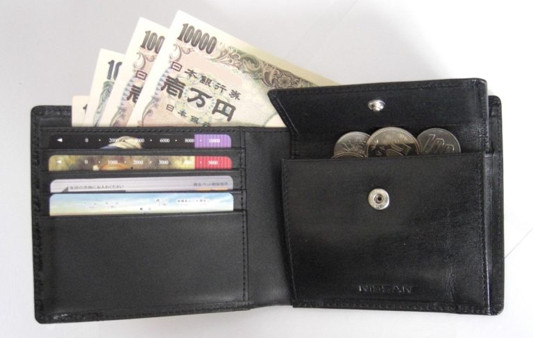 A small Japanese wallet photographed on a table.