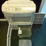 Dehumidifier with front panel removed (illustrative)