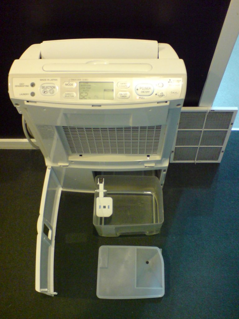 Dehumidifier with front panel removed (illustrative)