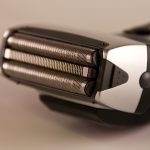 Electric shaver on white background