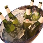 Bottle chilling in an ice bath bucket