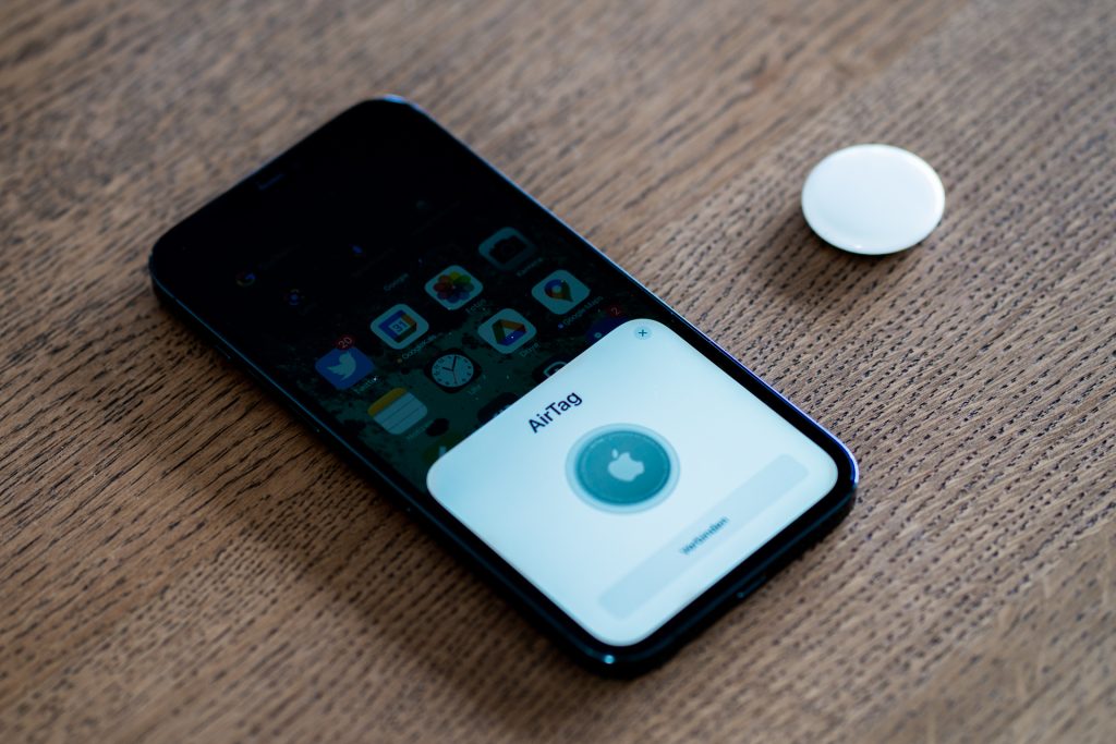 Apple AirTag being set up with an iPhone