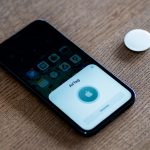 Apple AirTag being set up with an iPhone