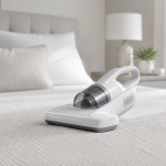 Generic handheld mattress vacuum cleaner on a neatly made bed