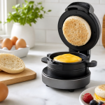 AI-generated editorial illustration of a compact breakfast sandwich maker with eggs, cheese, and English muffins on a kitchen counter